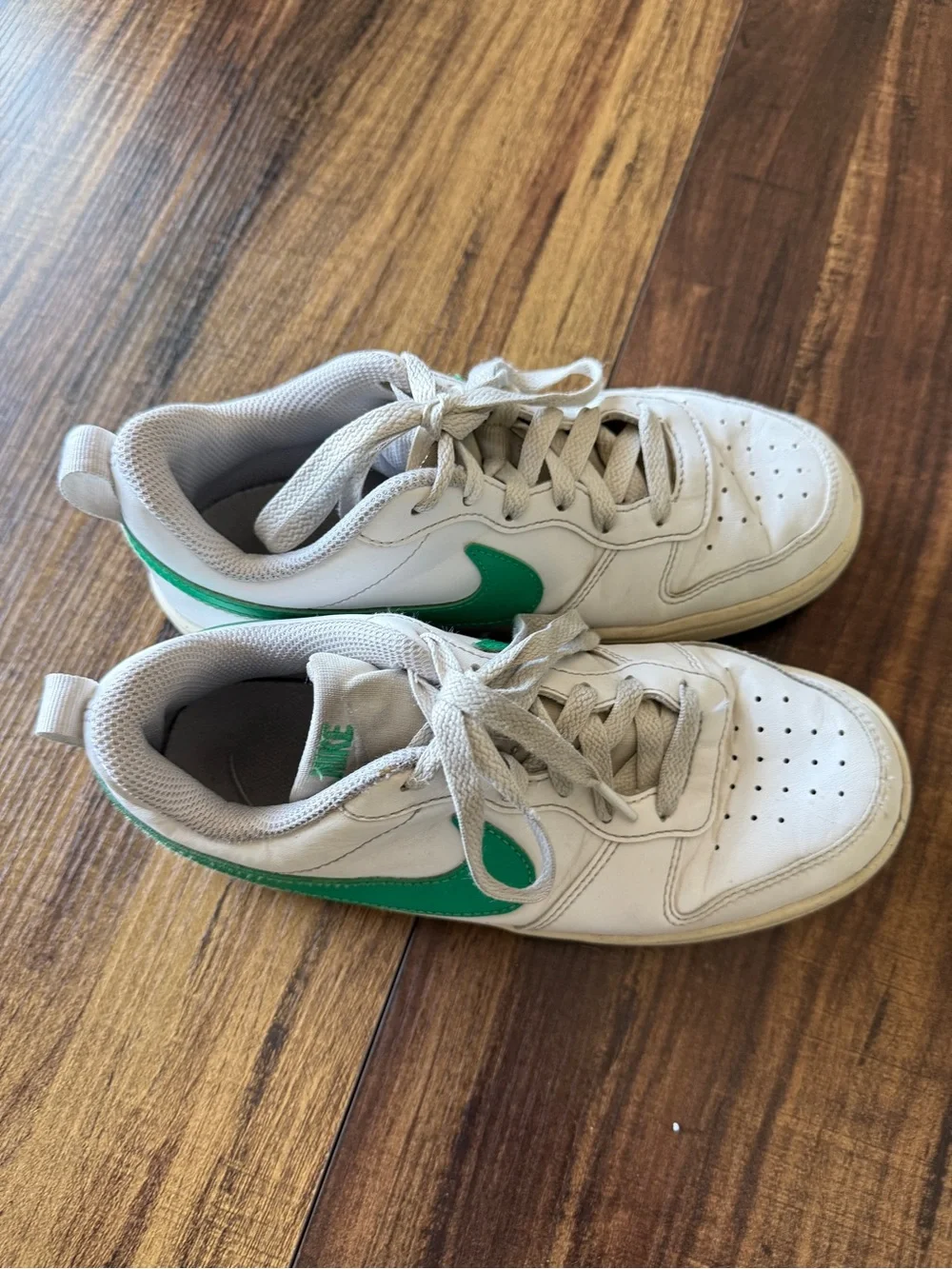 Nike White Low-Top Sneakers with Green Swoosh